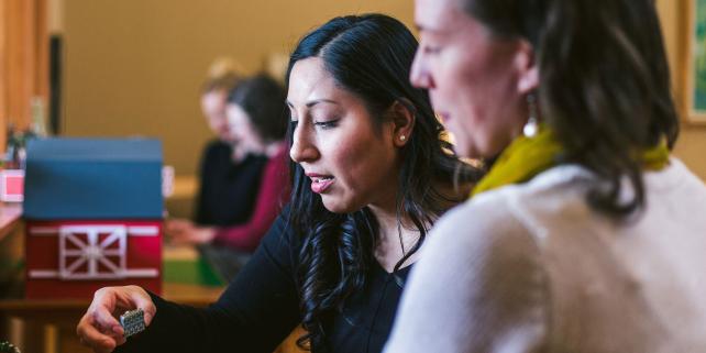 Trainees working with Montessori materials